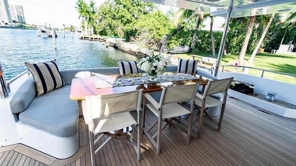 Aft deck dining table of luxury motor yacht La Fenice