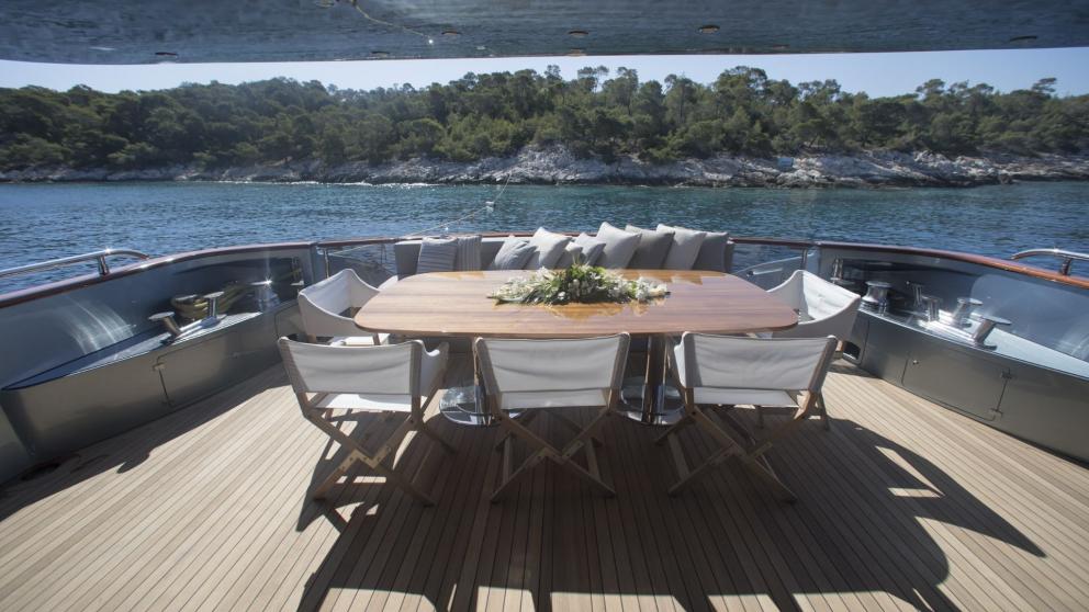 Aft deck dining table on luxury motor yacht Princess L
