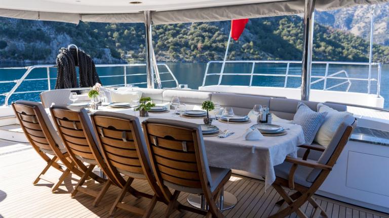 Deck dining table on the luxury gulet Son of Wind.
