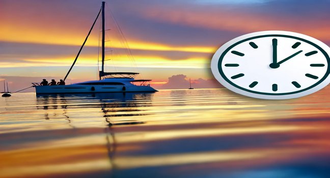 Yacht anchored in calm waters during sunset, with people relaxing on deck, surrounded by warm colors and reflections on the water