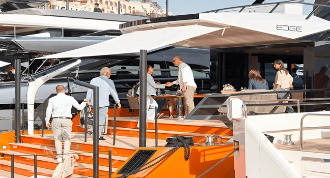 Guests shaking hands during a high-end yacht event on the marina