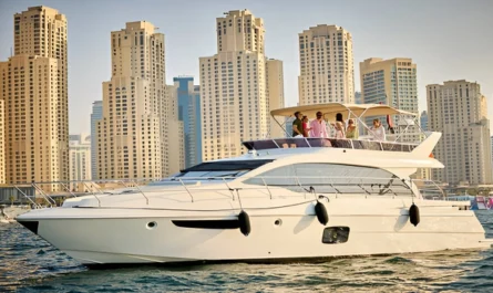 A group of friends enjoying a yacht cruise with the JBR skyline in the background