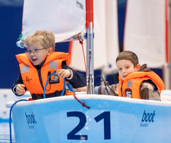 Kids Sailing Area at Boot Dusseldorf Children sailing small boat at Boot Dusseldorf