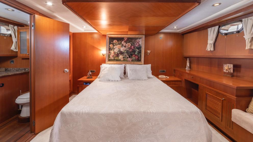 Bedroom with a large picture of roses on the wall