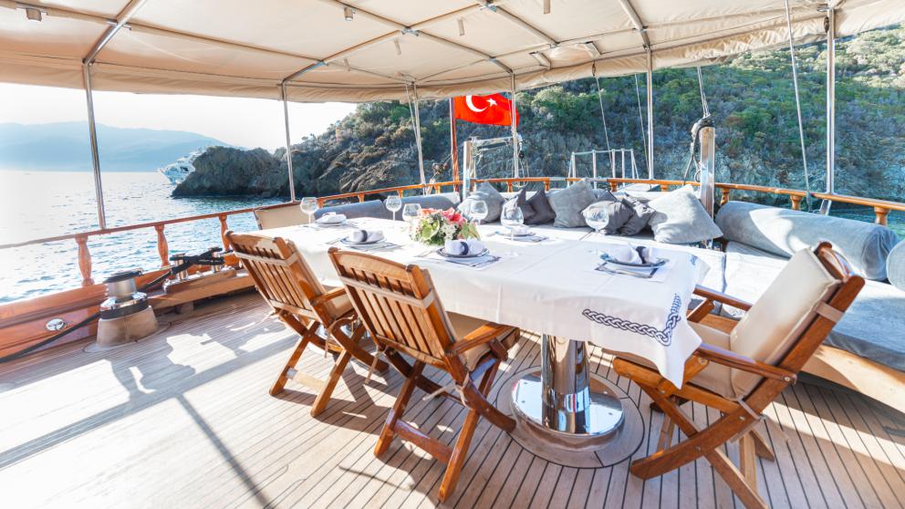 At the stern of the gulet is a chic dinner table