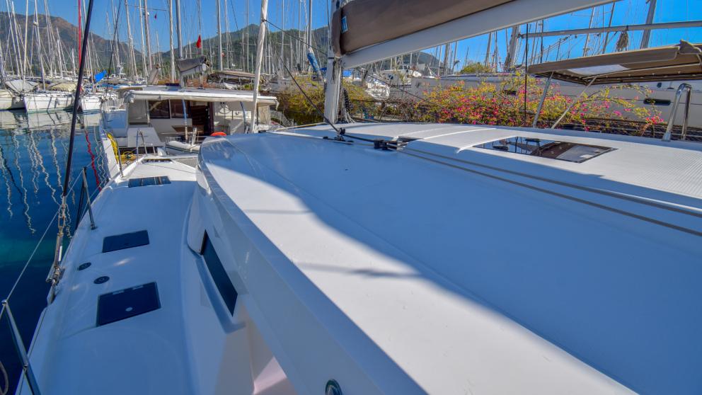 A view of the deck of the catamaran Sky Maria. You can see the masts of the yachts