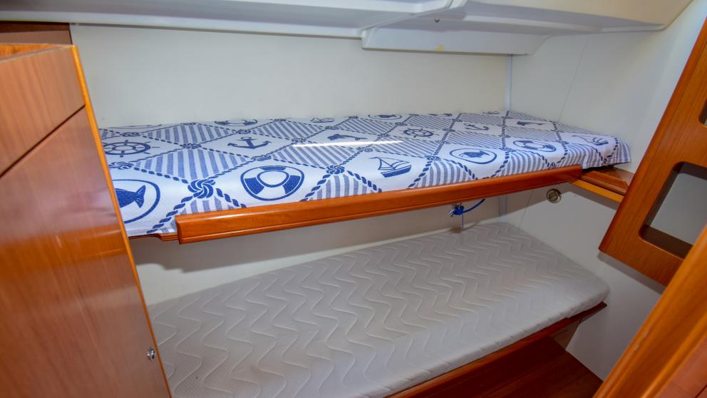 Bunk bed in a cabin with a minimalist design on a yacht