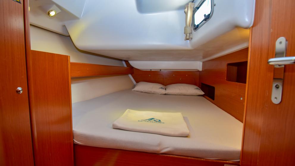 Entrance to a double cabin with a large bed on the sailing yacht Blondie