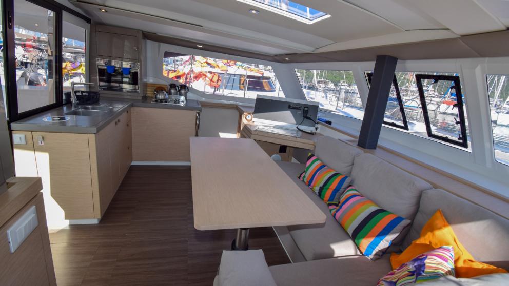 Cozy interior of the saloon on the catamaran Coco D