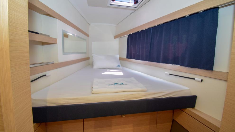 Double cabin with large bed, windows and storage shelves