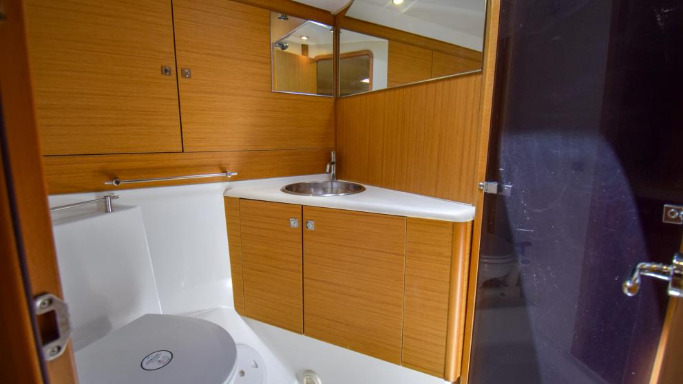 bathroom on a yacht. You can see the sink and toilet
