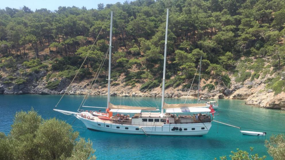 Anchorage in a picturesque bay in the azure sea