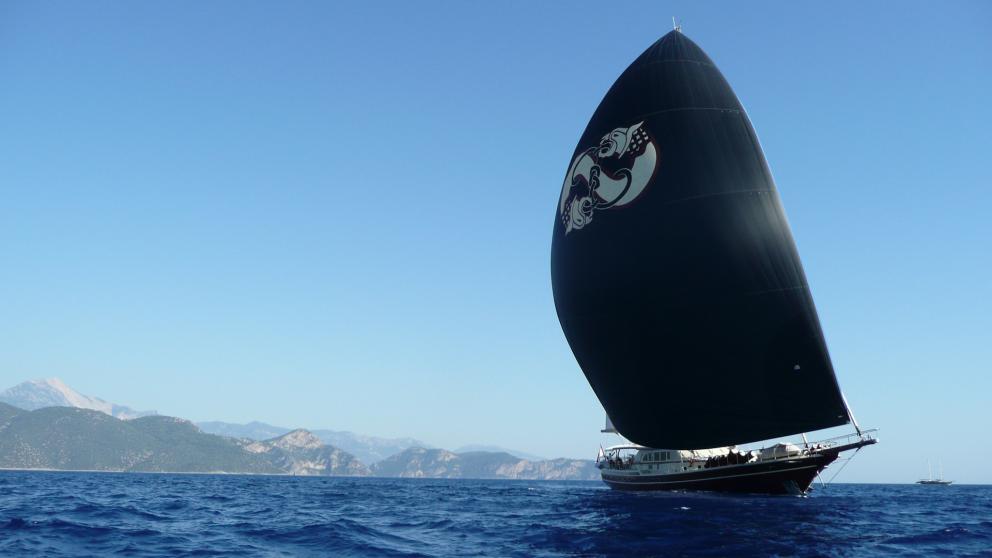 The luxurious Daima gulet on high waves with black sails
