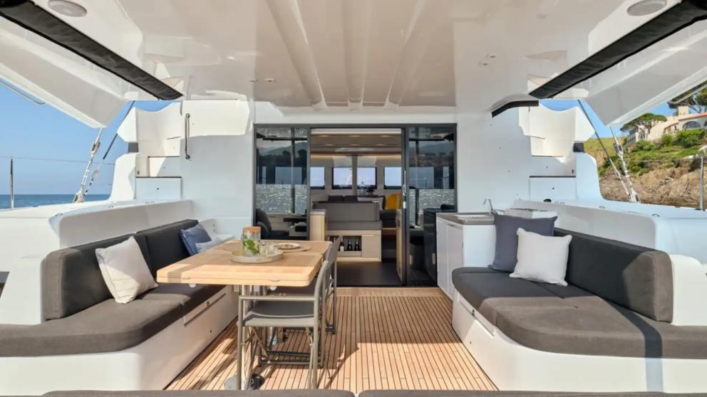 Dining and seating area on the aft deck of the luxury catamaran Jewel