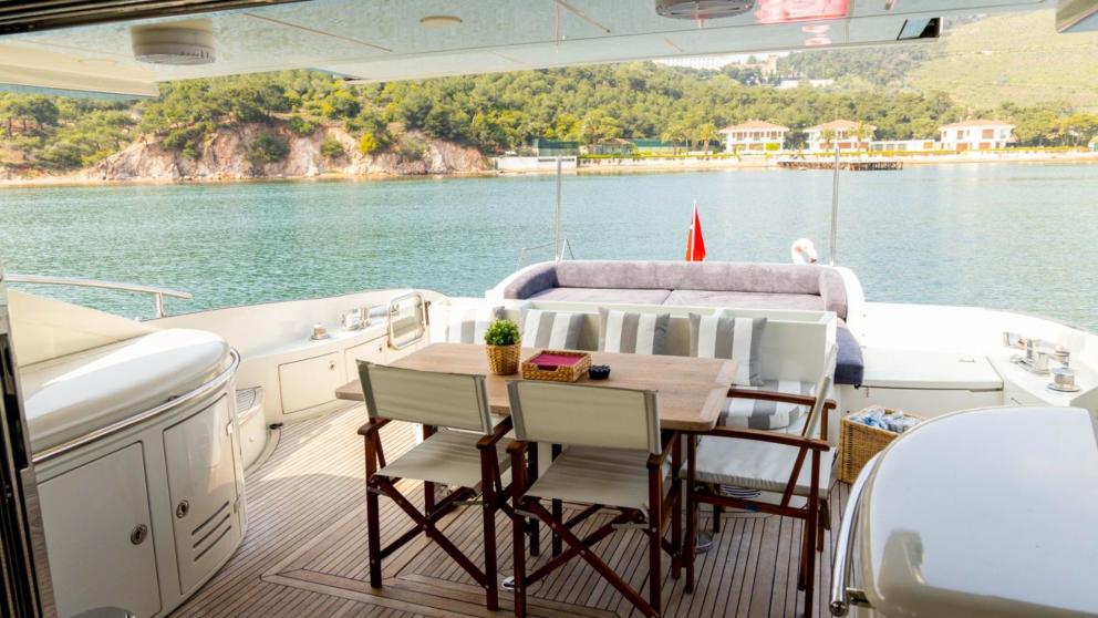 Dining and seating area on the aft deck of luxury motor yacht Sfk