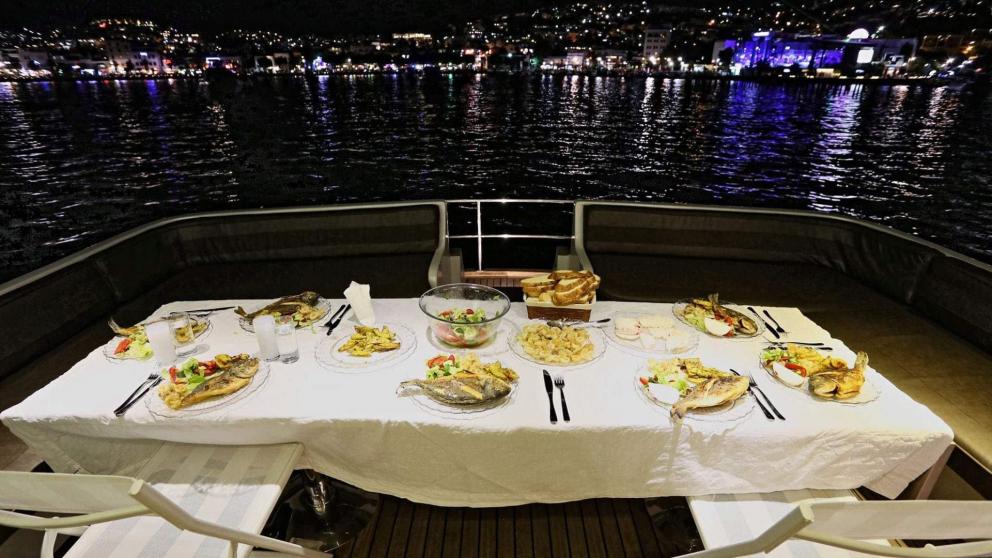 The aft deck dining table of the motor yacht Juliet.