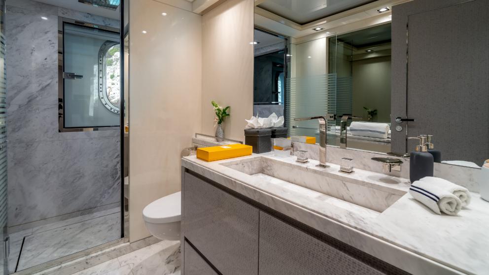 Elegant bathroom with marble details and high-quality fittings on a yacht