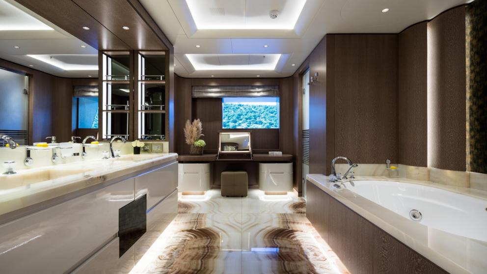 Bathroom on the Opari yacht with a large bathtub, double sinks, and sea views.