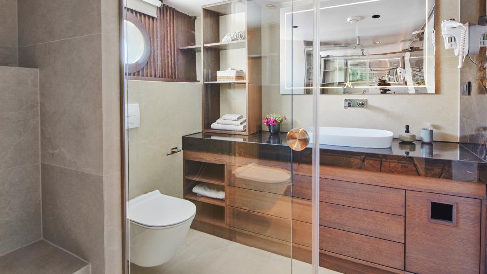 Elegant bathroom of Anima Maris with shower, toilet, and vanity.