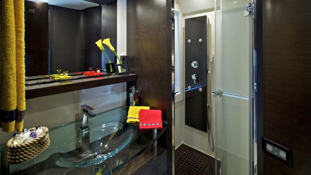 Stylish bathroom with a modern shower and elegant fittings on the motor yacht Thea Malta.