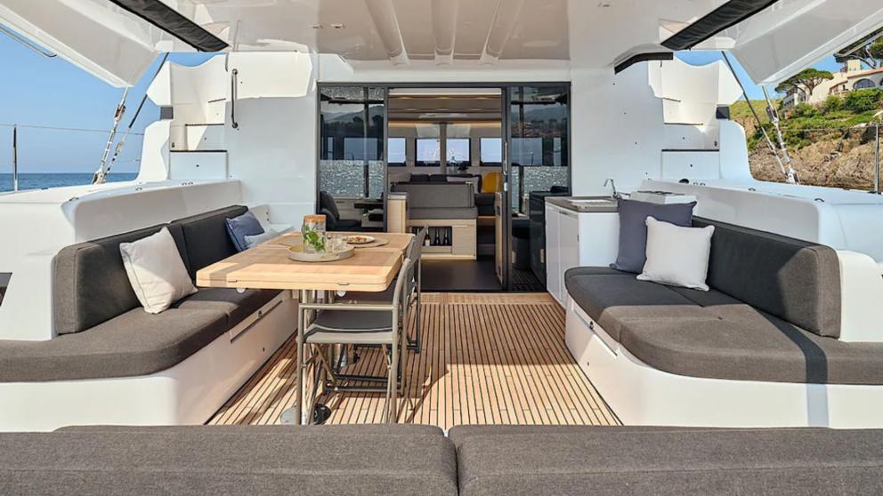 Catamaran Efkrati's aft deck dining table and seating area