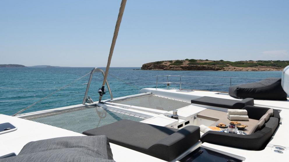 Foredeck sunbathing area of the luxury catamaran Royal Flush