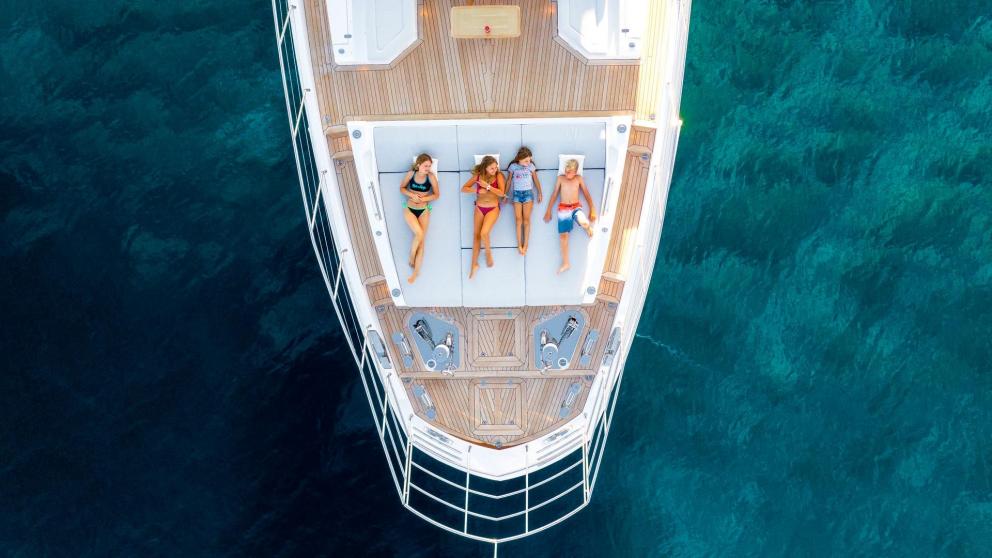 Guests enjoying the sun on the deck of the 27-meter motor yacht Dawo in Sibenik.