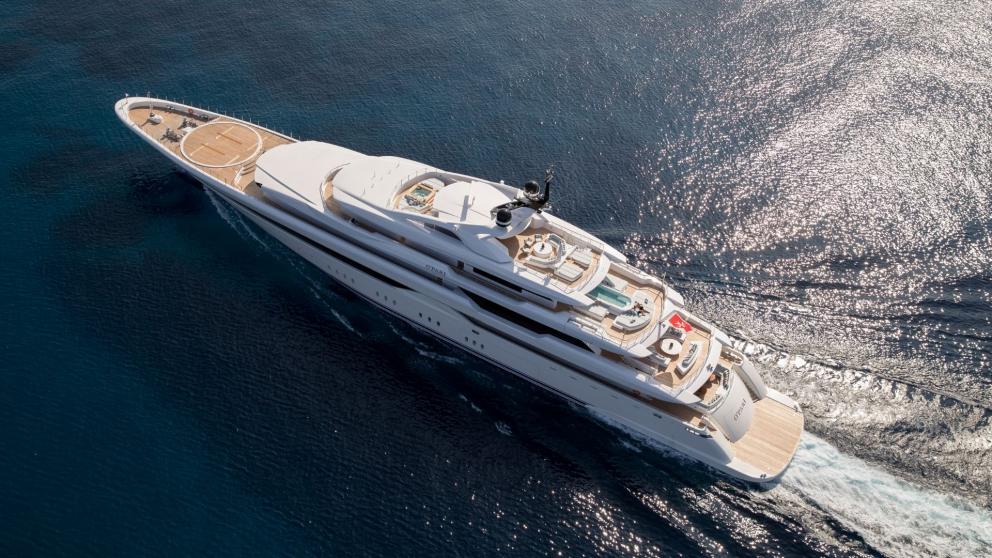 Luxury yacht Opari, elegant and modern, anchored near Greece's cliffs.