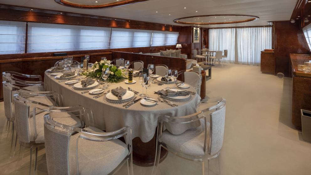 Luxurious dining room with a stylishly set table on the Sole Di Mare.