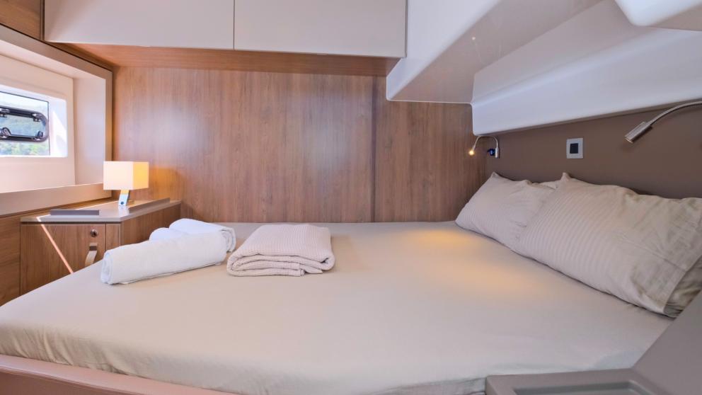 The catamaran's wood-patterned sleeping area creates a peaceful environment in the middle of the sea.
