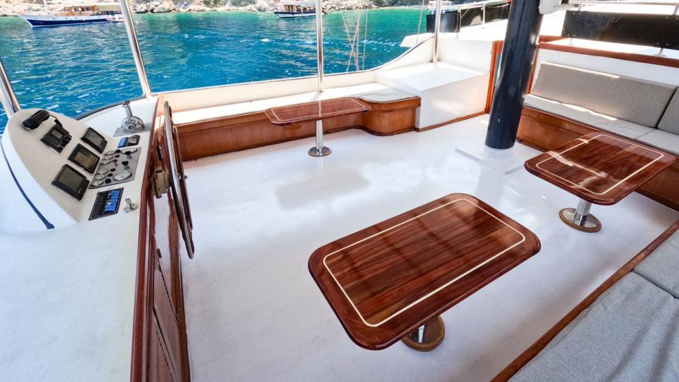 The gulet's luxurious steering position provides a comfortable working area for the captain.