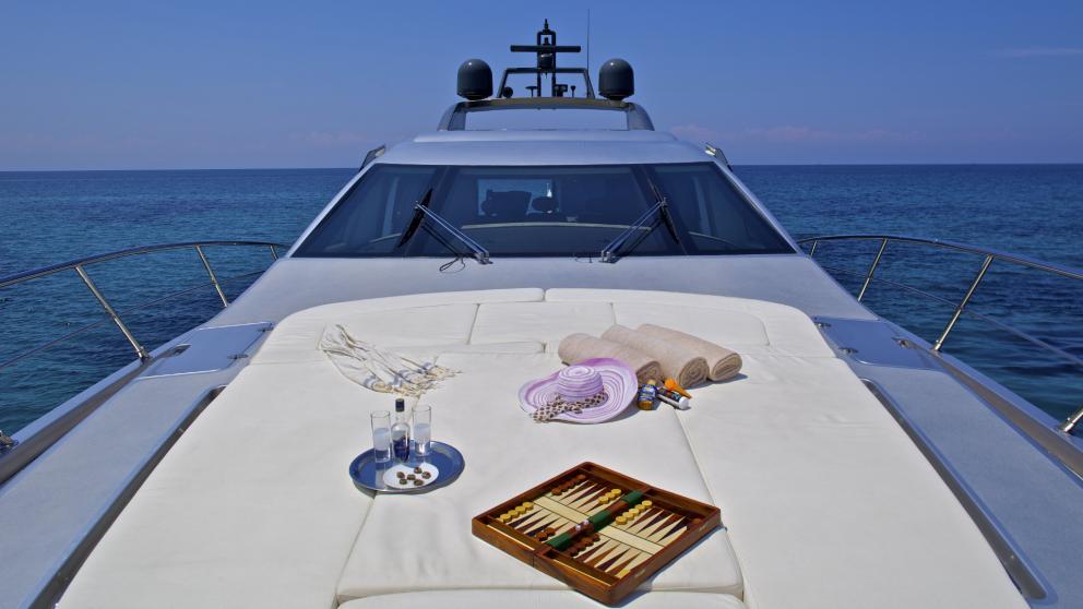 Luxurious relaxation area on the motor yacht Thea Malta with sea views and a backgammon game in Greece.
