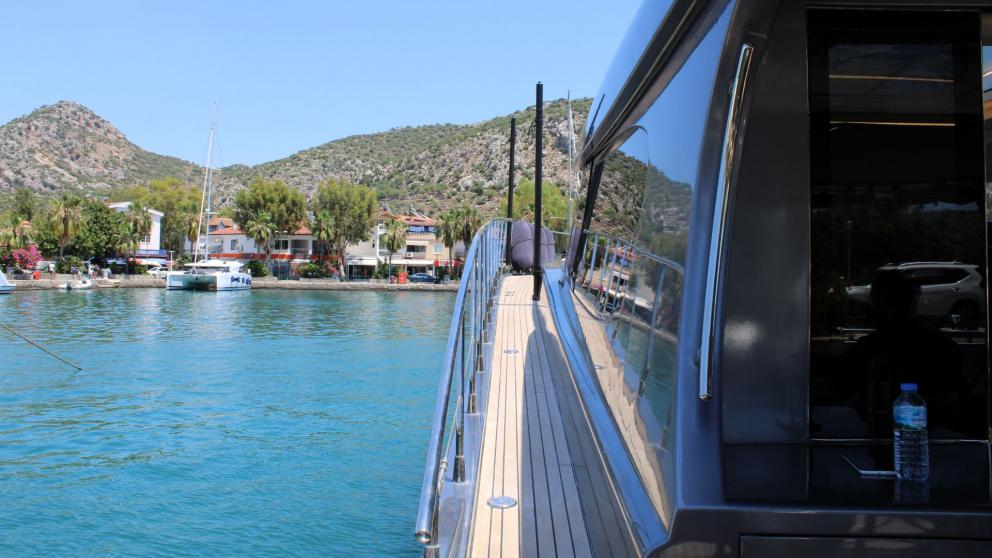 Port side deck of the luxury motor yacht Fundamental
