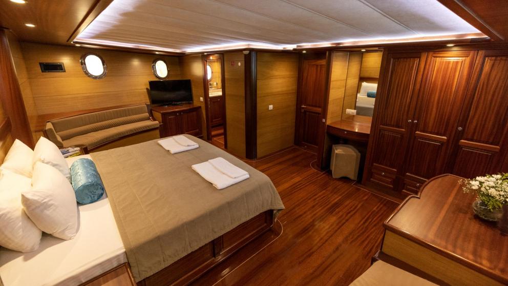 Spacious and elegantly furnished cabin of a traditional Turkish gulet with five cabins.