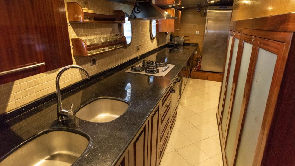 Fully equipped and modern kitchen of a traditional Turkish gulet with five cabins, ideal for culinary delights while tra