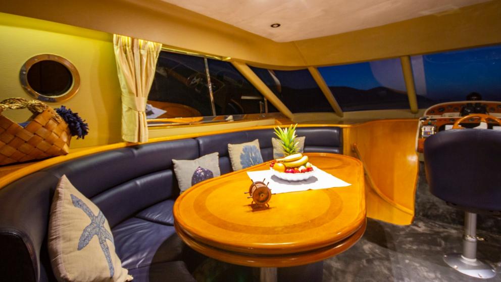Wheelhouse with sofa and table on motor yacht Newdawn