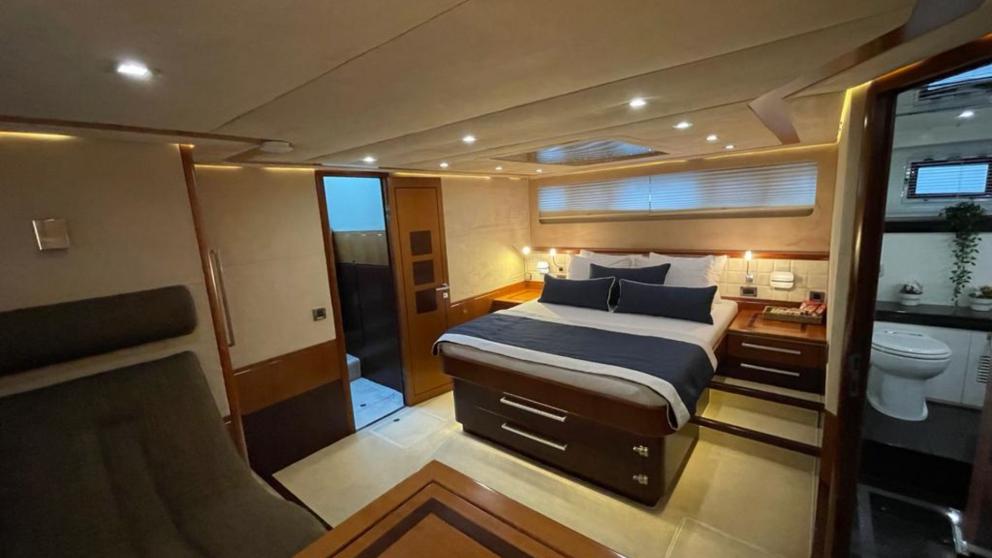 The spacious bedroom of the luxury motor yacht Melissa My Angel in Göcek features a comfortable bed and modern decor.