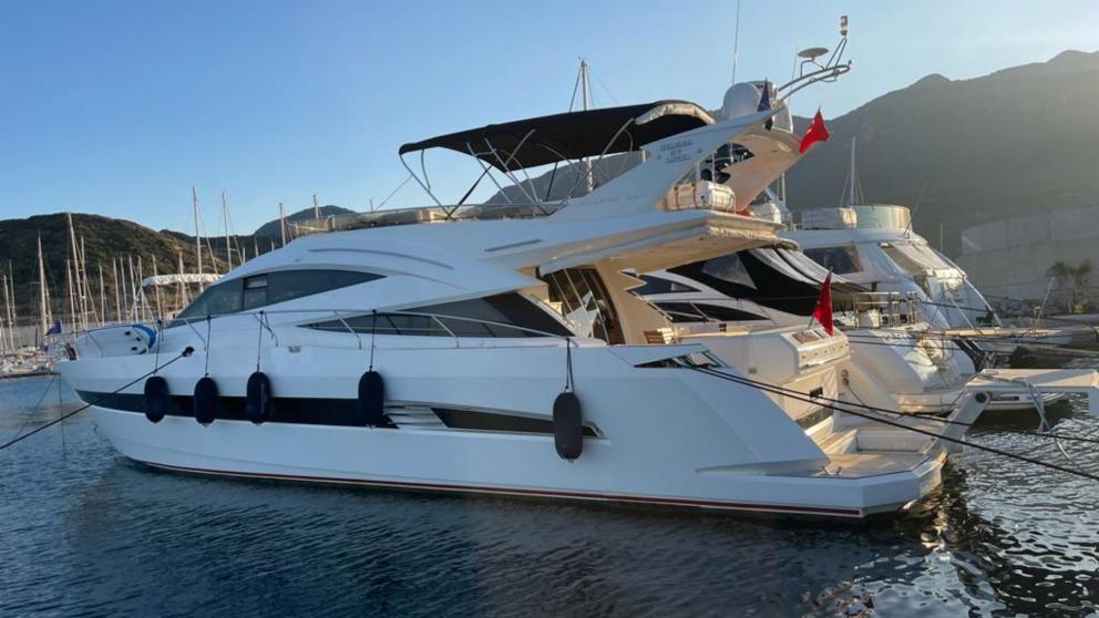 The luxury motor yacht Melissa My Angel is docked at the port in Göcek, ready for a comfortable cruise.