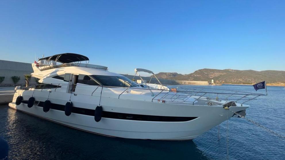 The luxury motor yacht Melissa My Angel is anchored at the port in Göcek, ready to set sail.