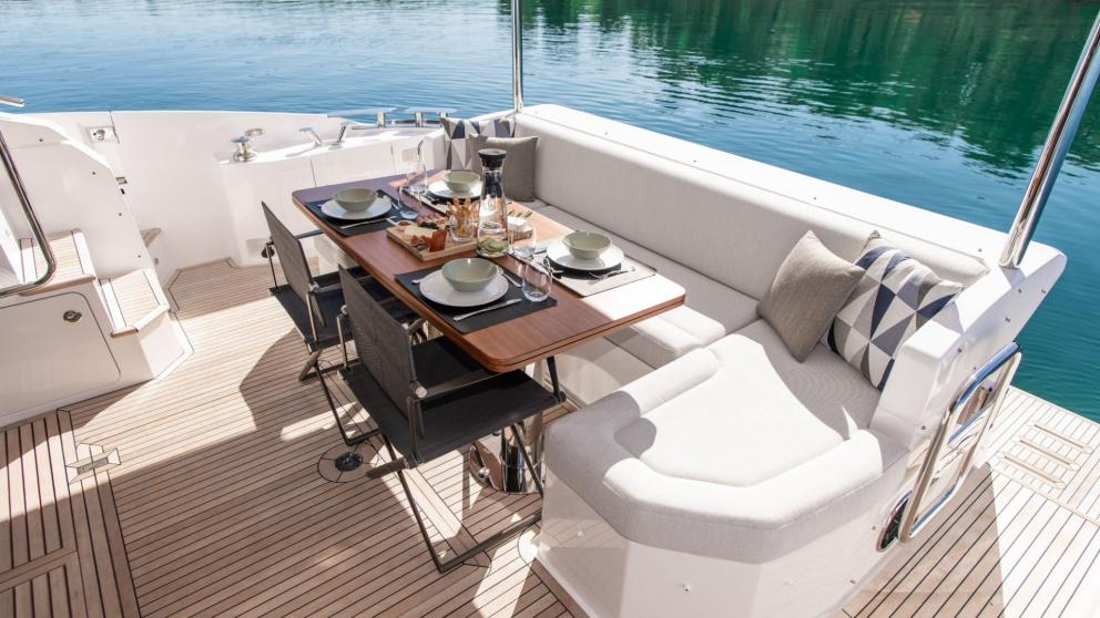 Deck dining table on the motor yacht Alibaba