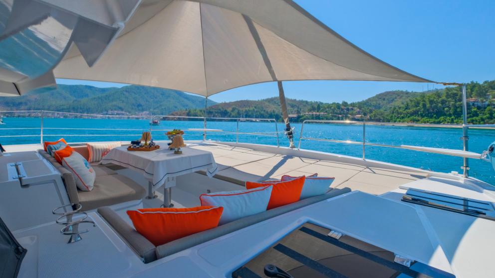 The catamaran's seating area allows you to enjoy pleasant conversation while sheltered from the sun.