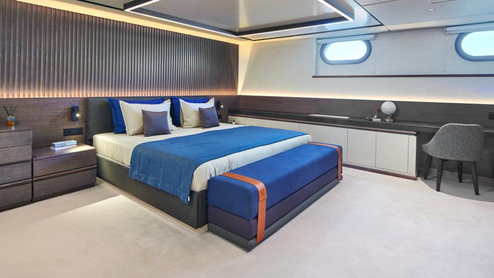 Modern and elegant master cabin of Anima Maris with a large bed and stylish decor.