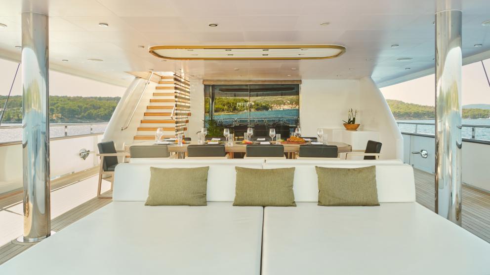 Stylish dining room and lounge area aboard Anima Maris, overlooking the sea in Croatia.