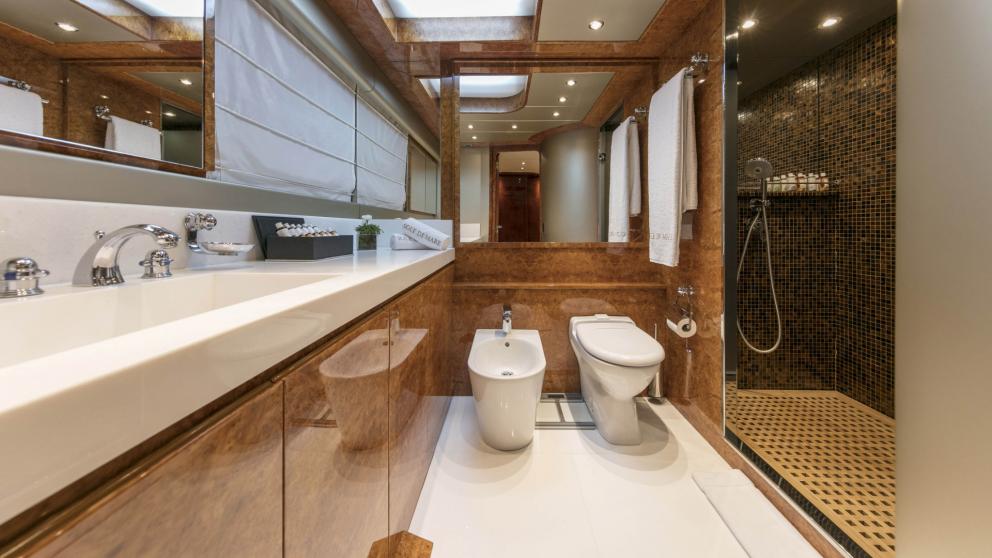 Modern bathroom with large shower and double sink on the Sole Di Mare.