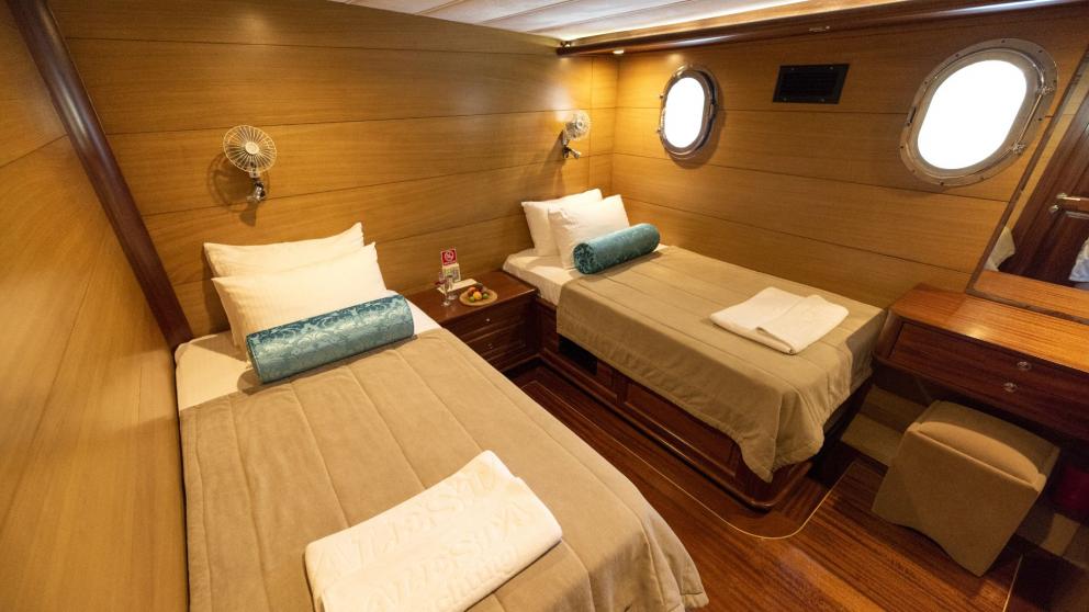 Comfortable and stylishly furnished double cabin of a traditional Turkish gulet with five cabins.