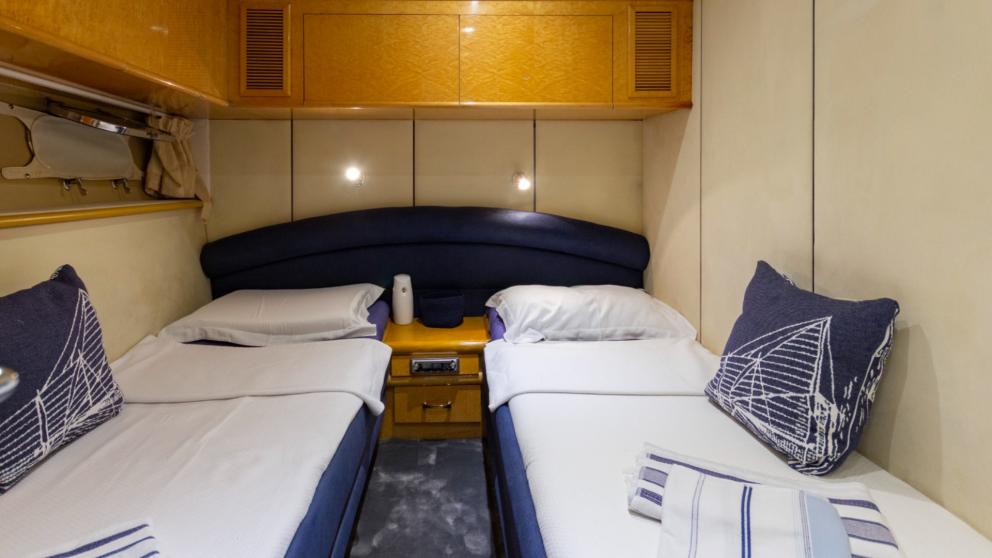 Double cabin with twin beds and storage cupboards on Newdawn
