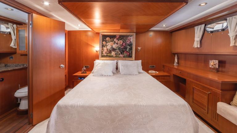 Bedroom with a large picture of roses on the wall