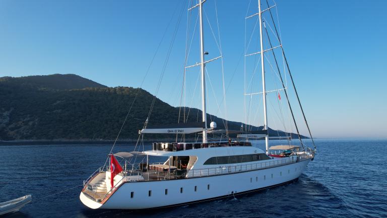 Luxury yacht Queen of Makri sails on the waters of Gocek towards a bay