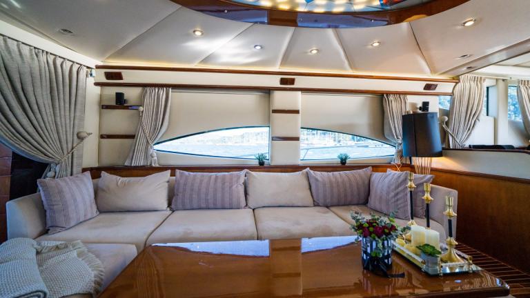 Living area inside the luxury yacht with fine, comfortable furniture and decoration.