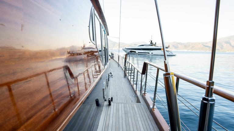 The side deck of the Emanuel gulet. You can see the luxury yacht next to